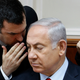 In this July 23, 2018 file photo, Israeli Prime Minister Benjamin Netanyahu listens to his spokesman David Keyes as he opens the weekly cabinet meeting at his Jerusalem office.